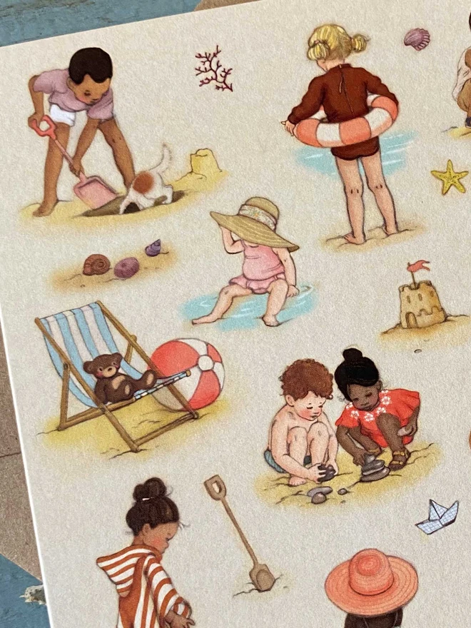 detail on vintage story book style iluutsrted greeting card featuring little children playing on the beach