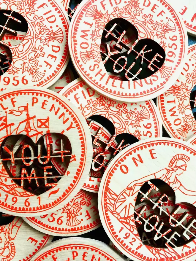 Beautiful screenprinted coins by Fiona Biddington read 'you and me' 'True love' and 'I like you'