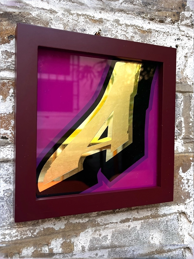 Gold leaf letters framed
