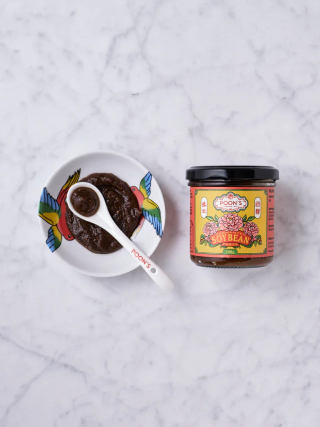 Fermented Soy Bean Paste. A jar of paste with a sample in a dish.