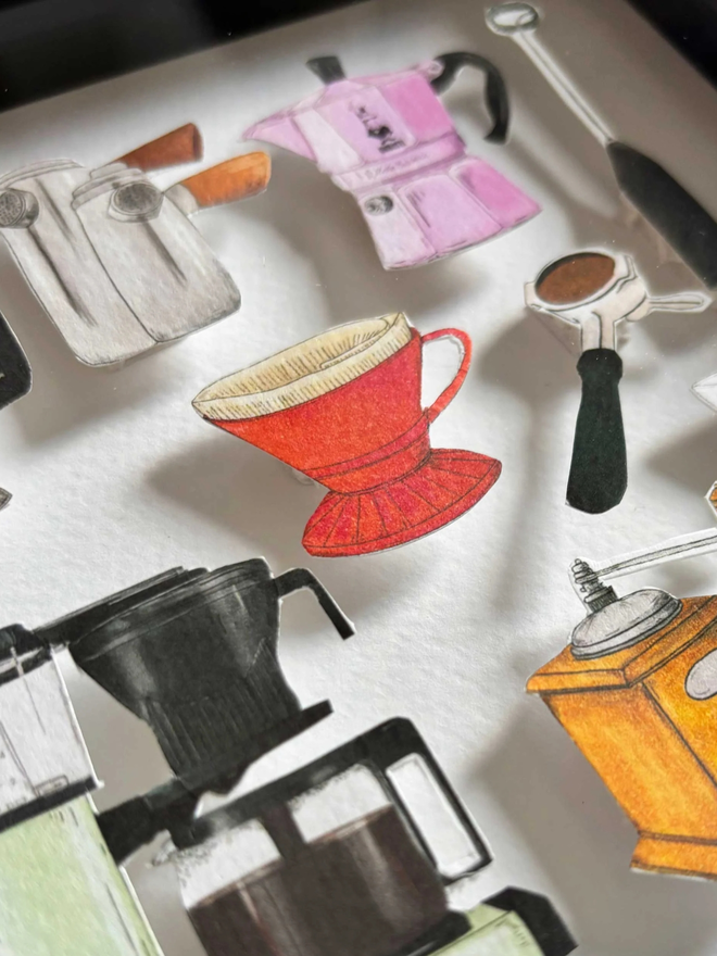 Close-up of an illustrated 3D paper collage featuring a collection of hand-cut coffee maker illustration