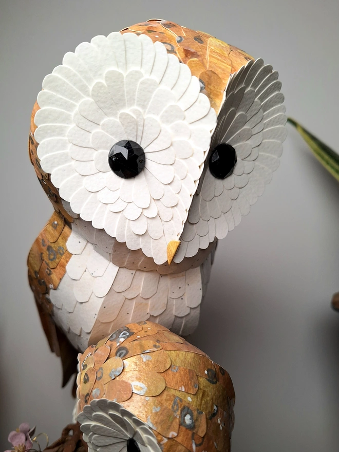 Close up of a barn owl sculpture 