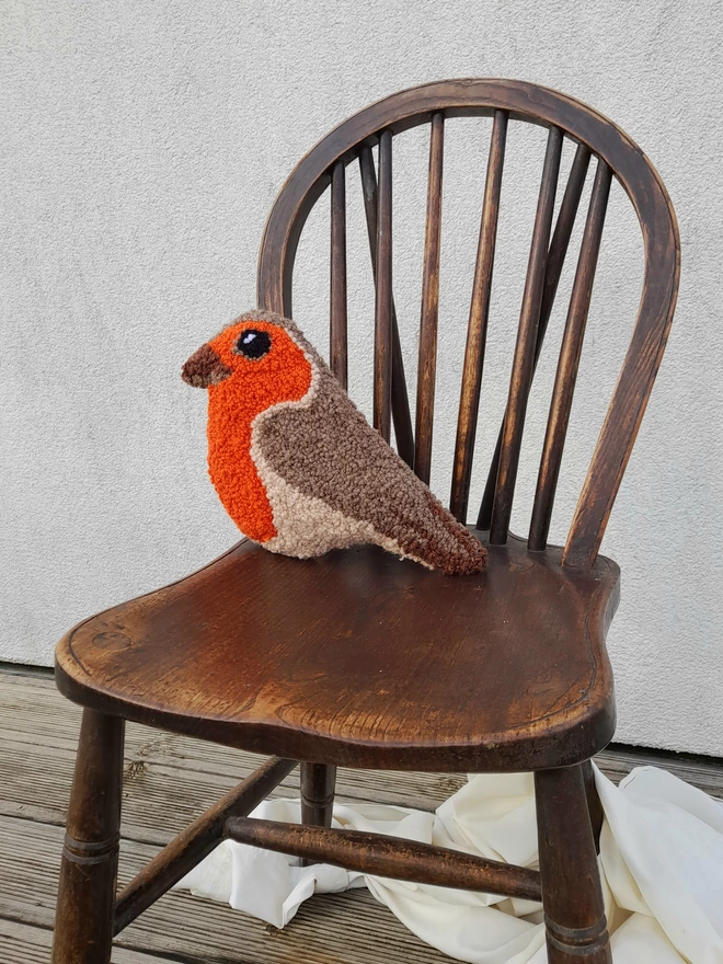 Sweat Wee Small Robin Cushion on Vintage Dark Wooden Chair