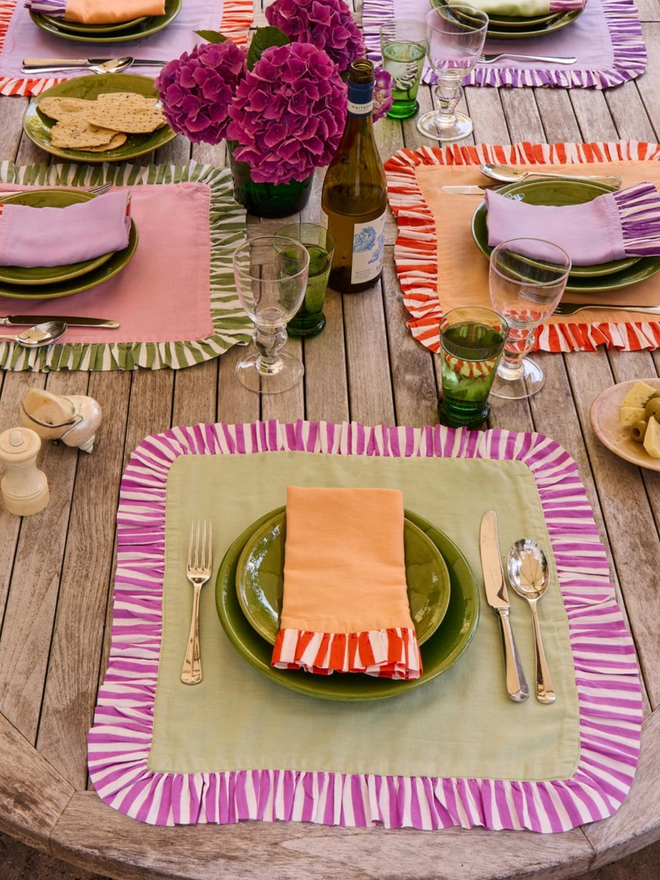 Pair of Ruffle Napkins. A selection of the napkin colour available spread out on a table.