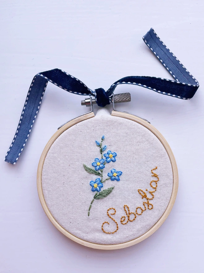 Memorial keepsake with forget-me-nots and the name ‘Sebastian’