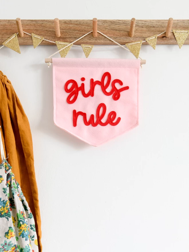 girls rule mini felt banner baby pink banner with red text.