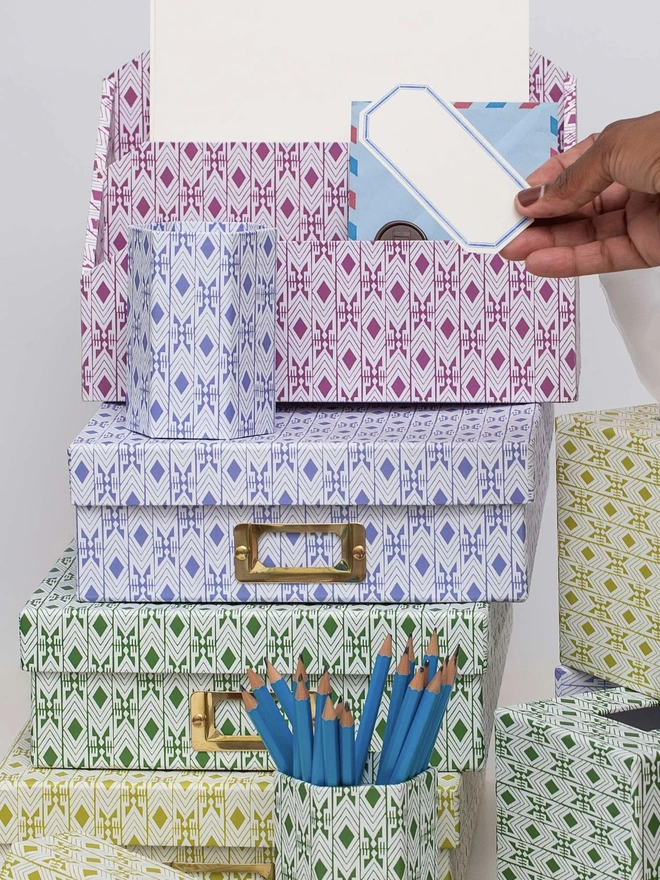 Tijan Letter Rack, a colourful patterned letter rack sitting with other organisational accessories.  