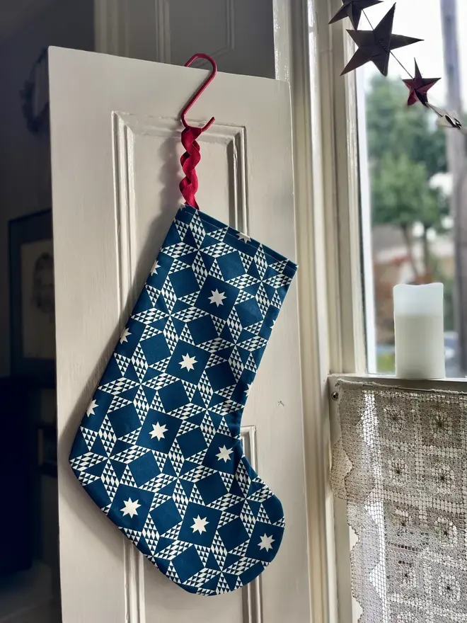 Clara Organic Printed Stocking, hanging.