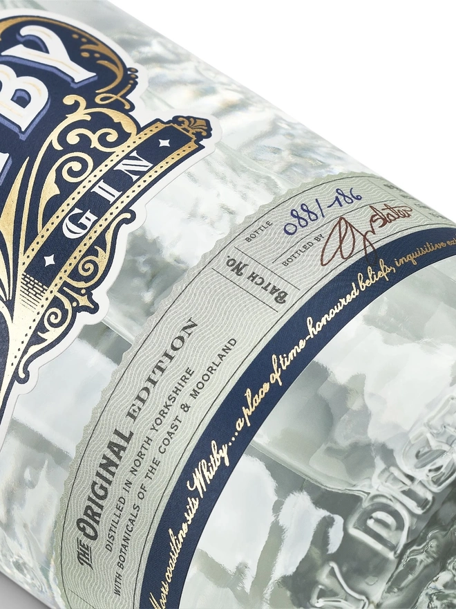 Original Edition Gin, a bottle of gin sitting on a plain white surface. 