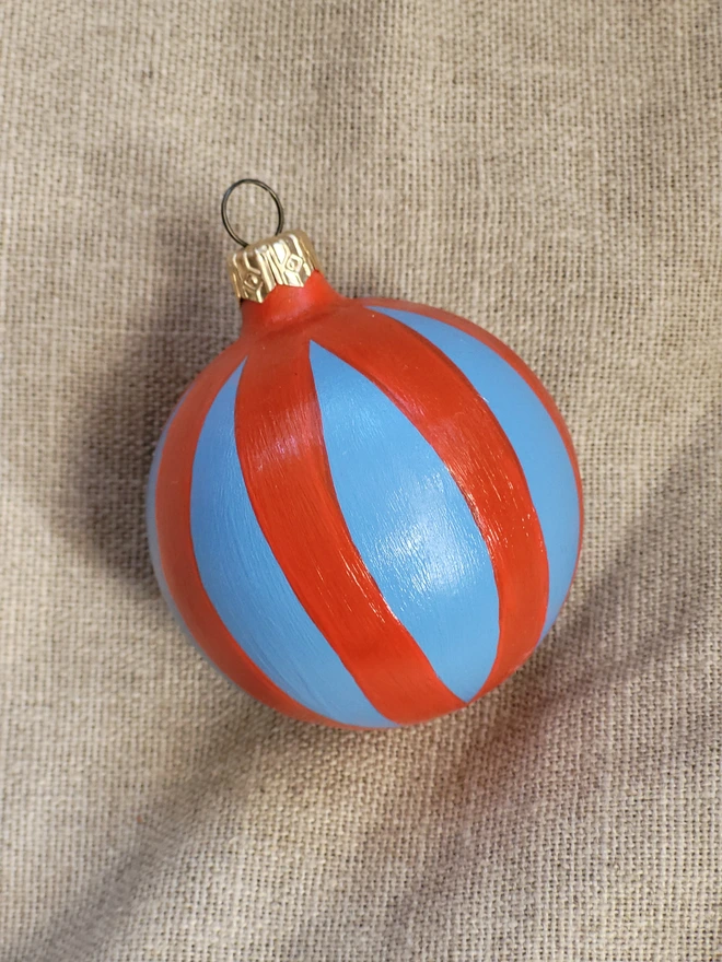Sky blue bauble with bright red stripes