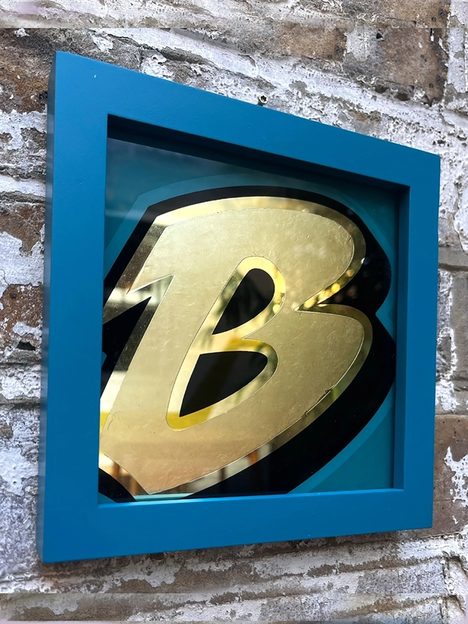 Gold leaf letters framed