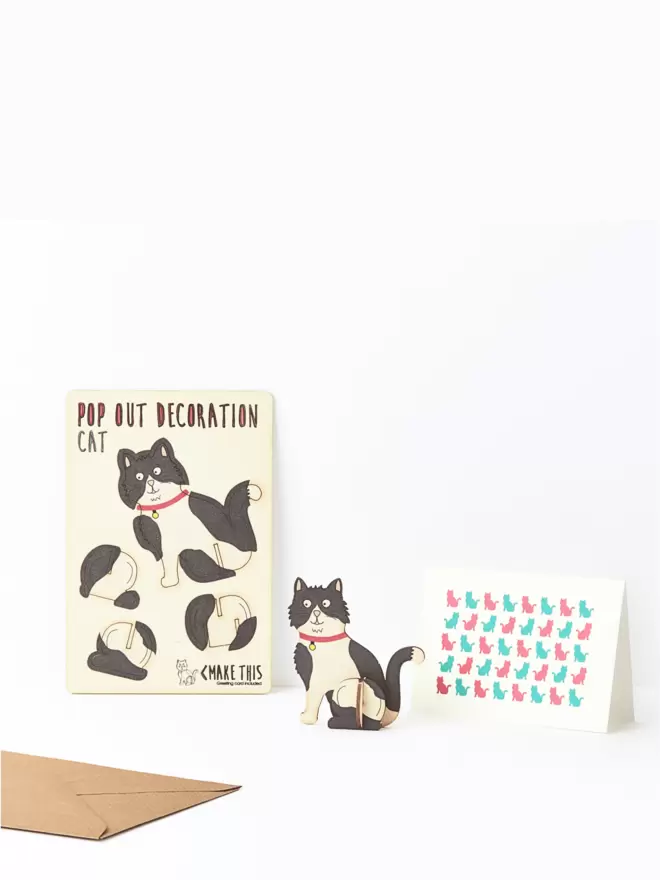 Black and white cat decoration and cat pattern greeting card and brown kraft envelope on a white background