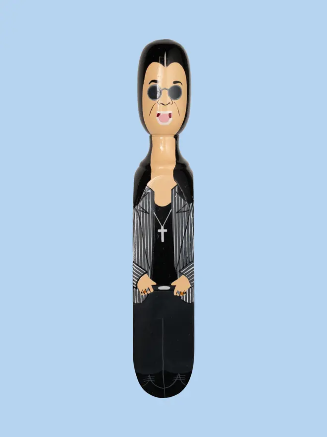  Wooden Door Stopper (Oz), a colourful wooden door stop sitting on a plain white surface. 