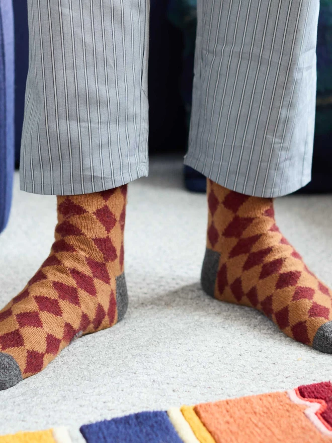 colourful patterned ankle socks, modelled in a colourful room