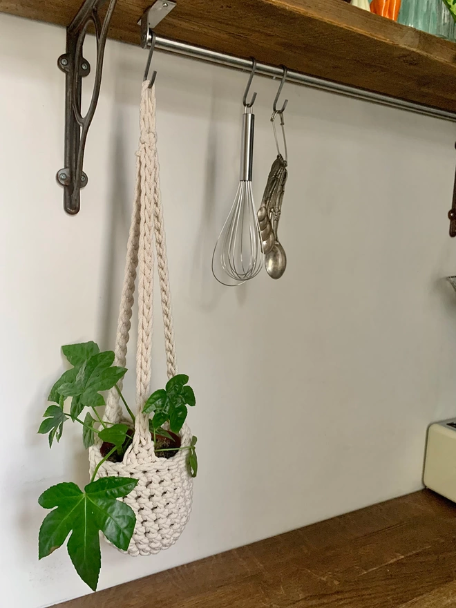 medium indoor cream hanging plant holder, recycled cotton cream three string hanging planter, handmade sustainable crochet decor, rustic natural organic homeware accessories, hanging ceiling plant holder with basket and hook to hang