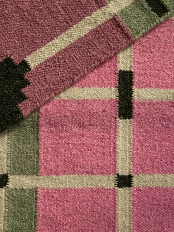 Corbie Flatweave Rug, a colourful rug sitting on a household floor. 