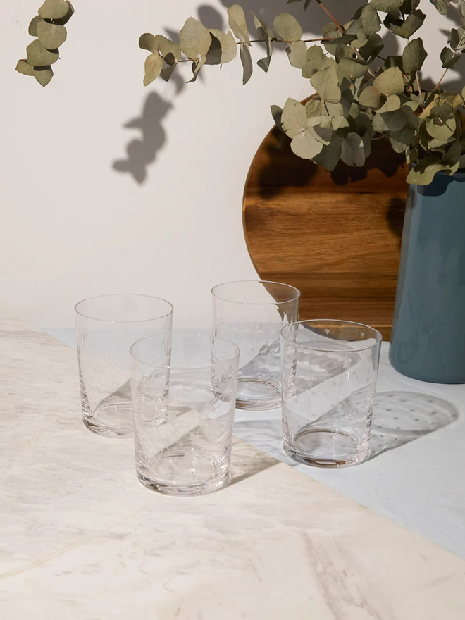engraved ovals large crystal tumblers (set of 4). a large drinks glass with a detailed oval pattern.
