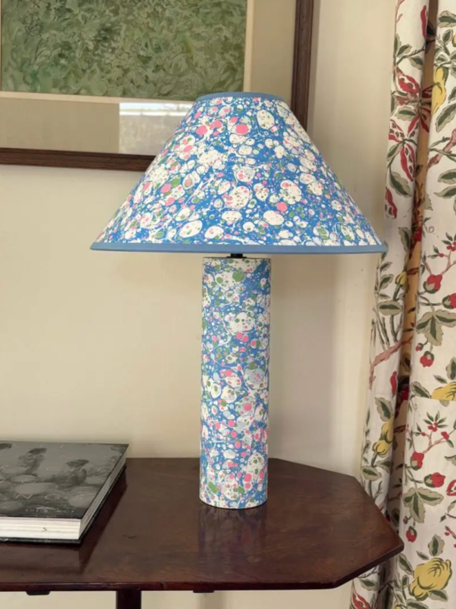 Marbled on Marbled Base & Shade. A blue lampshade and base on a table.