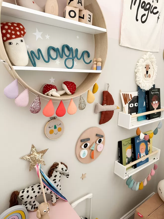 'magic' wire wall hanging decor for kids room on a shelf in a decorated play room area. 
