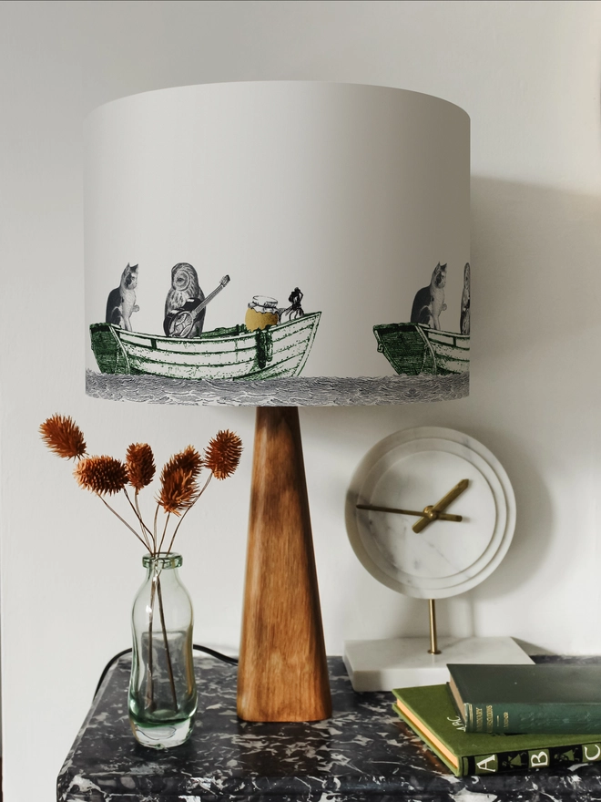 Handcrafted Owl and the Pussycat lampshade featuring a whimsical pea green boat illustration, bringing a touch of nostalgic storybook charm to the home.