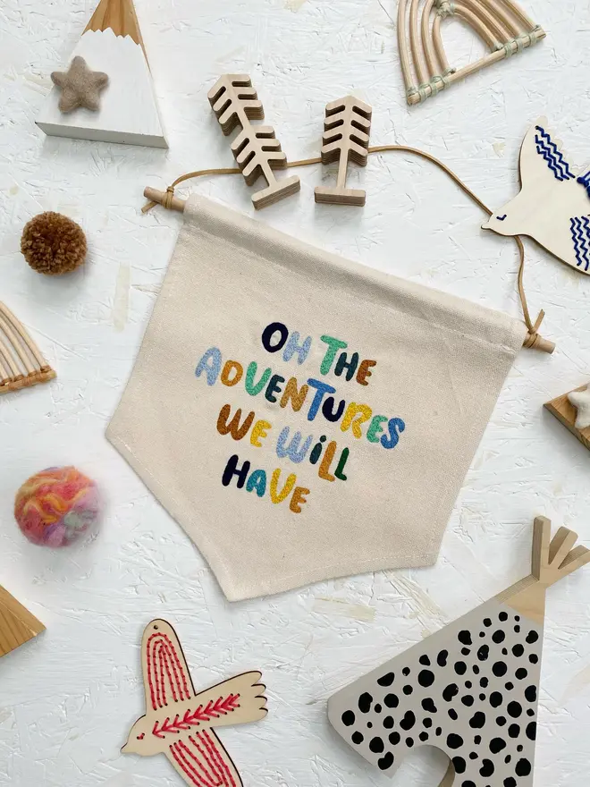 custom embroidered phrase banner. cotton banner embroidered with 'oh the adventures we will have'