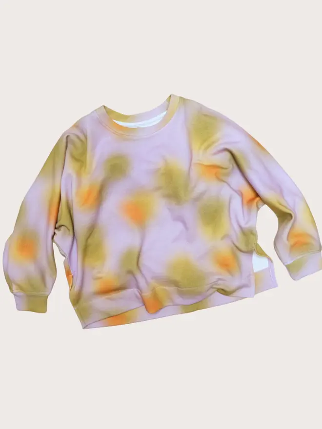 Front flat lay of the Studio Koter Riverson top in Hazy Lilac, a soft-print crew neck sweatshirt with dropped shoulders and side splits.