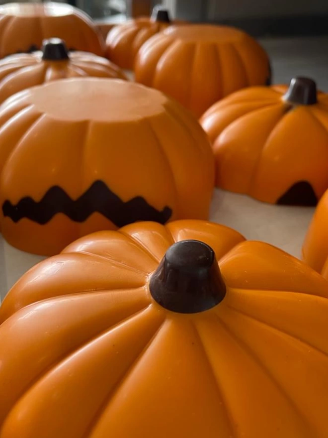 Orange Pumpkins on chocolate rack