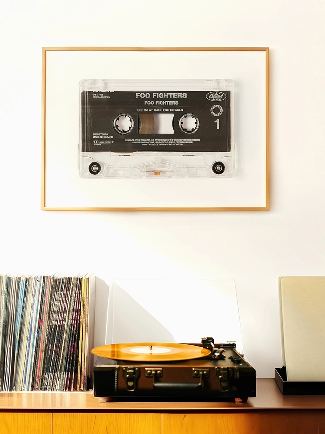 foo fighters cassette tape print. framed print hung above record player and vinyl collection.