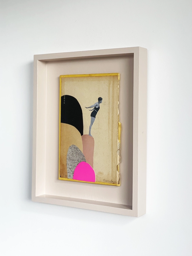 A female diver stands on a range of rocks as she leans in to dive into the sea below. A frame collage made with vintage papers and pop of neon pink with torn edges and interesting textures.