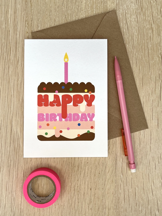 Happy Birthday cake card with candle, icing and sprinkles