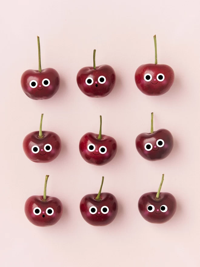 9 Red Cheery Cherrys on a pink background 