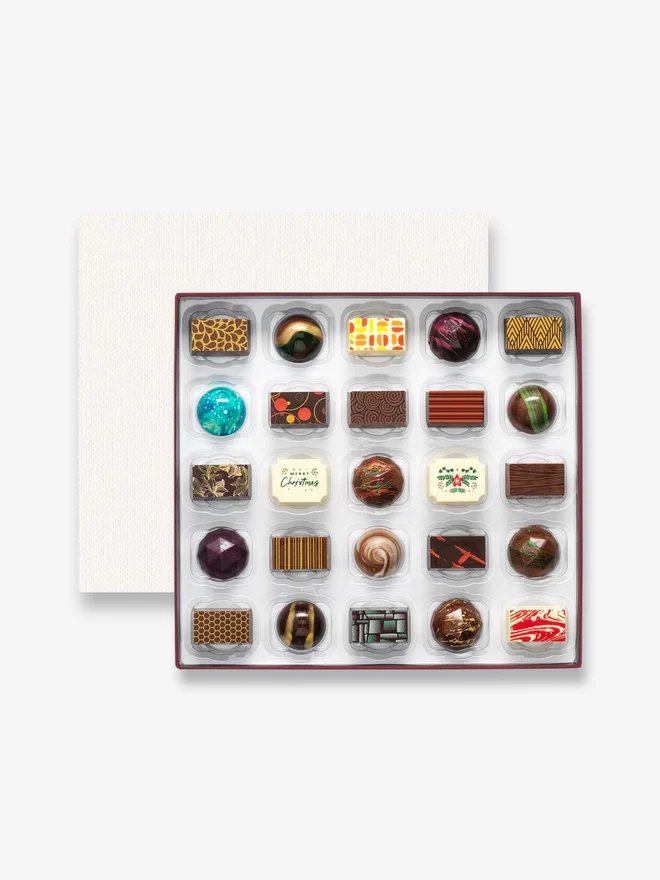 A box of 25 Christmas themed luxury chocolates by Harry Specters