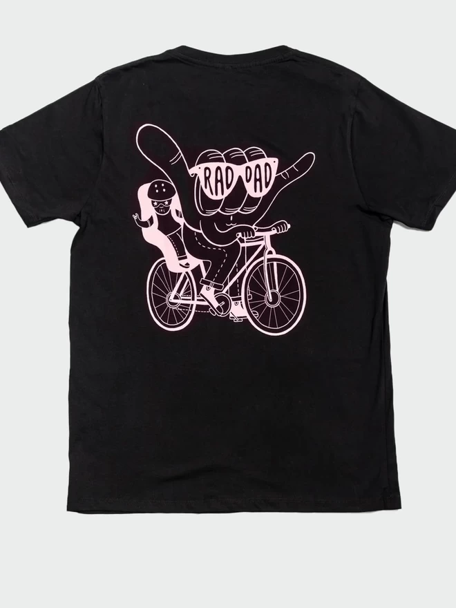 The back of the Black & Beech black Rad Dad cycles t-shirt, showing the pink illustration of a hand wearing sunglasses  riding and child riding a bicycle 