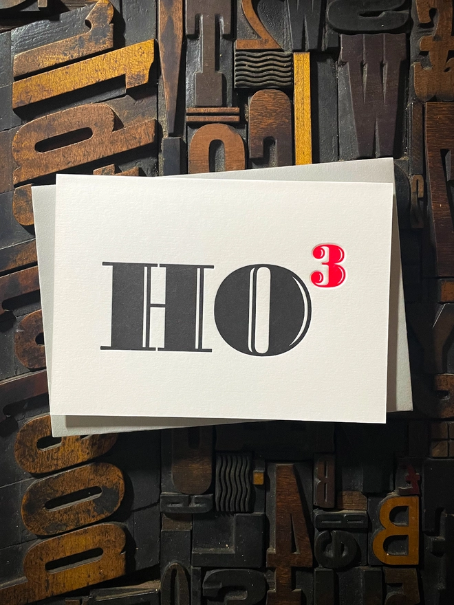 Ho Ho Ho! A beautiful typographic letterpress Christmas card. Printed in rich vibrant red and deep black inks with luxury matching and contrasting envelopes; ideal to send to your designer friends at the festive season.