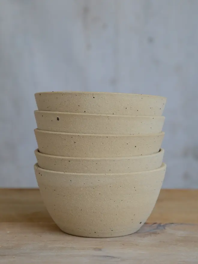 Stack of cereal soup bowls showing exterior raw flecked stoneware