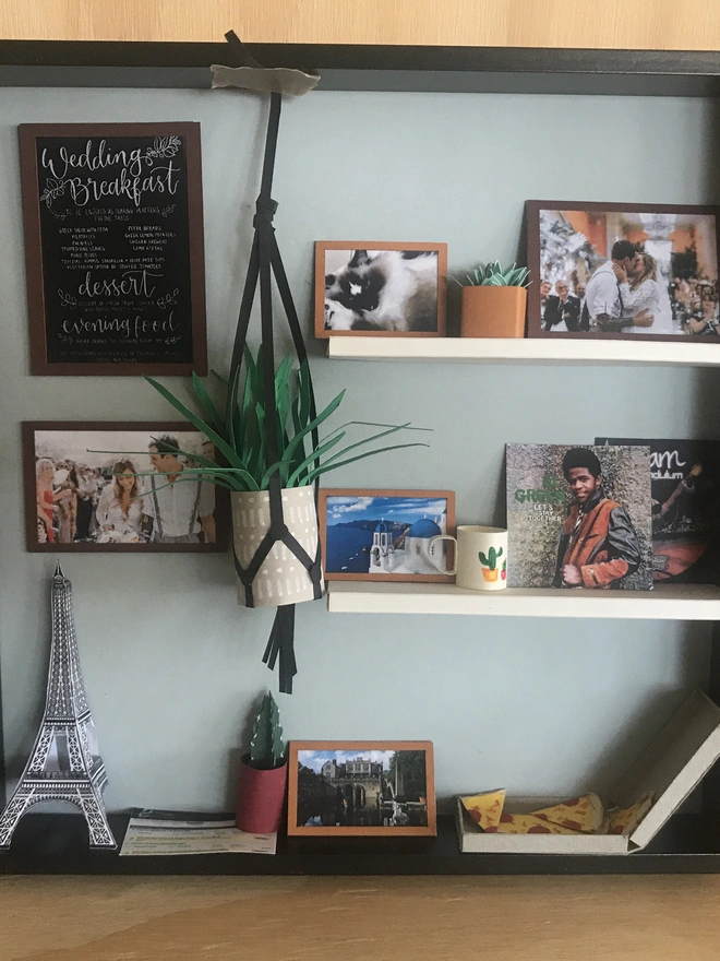 a wooden box with miniatures of the person favourite things inside. Each piece is handmade specially on request. bespoke art piece made by My Papercut Forest