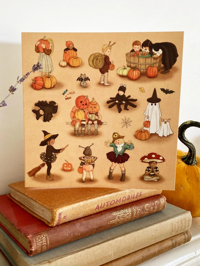 a halloween greeting card featuring lots of children in spooky fancy dress