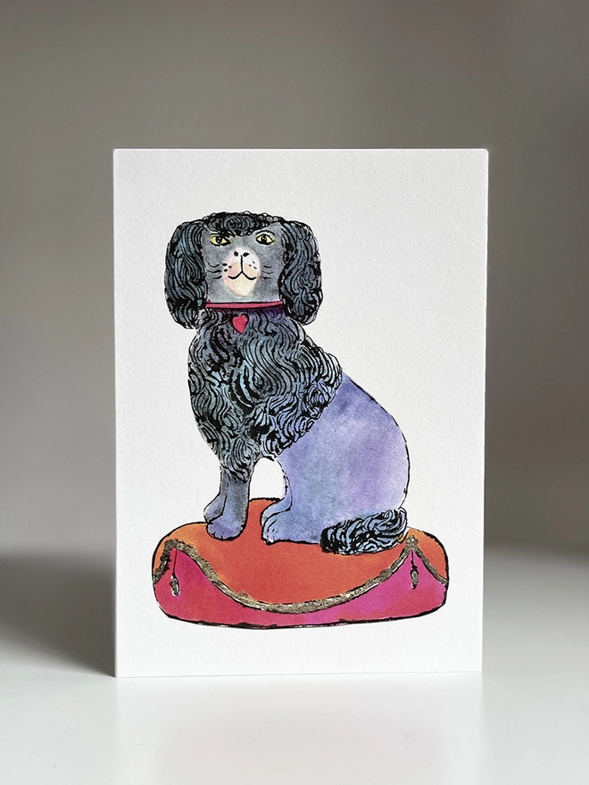 Greeting card featuring a pen and ink illustration of a poodle dog sitting on a fancy cushion with a Wedgwood blue envelope and blank inside for your own message.