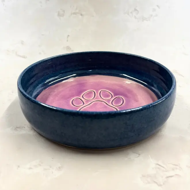 Landscape Dog Bowl, a colourful dog bowl sitting on a stone surface. 