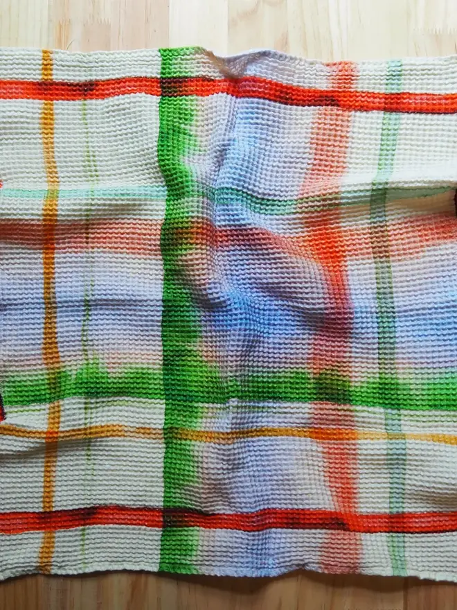 Check Waffle Tea towel, spread on a table. 