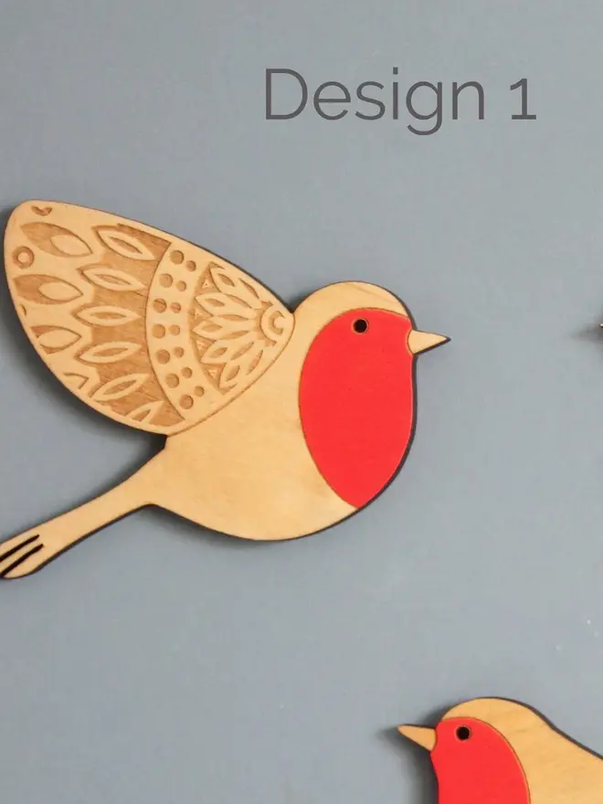 Folk Art Wooden Wall Robins (Set Of 3), a wooden robin hung up flying on a wall