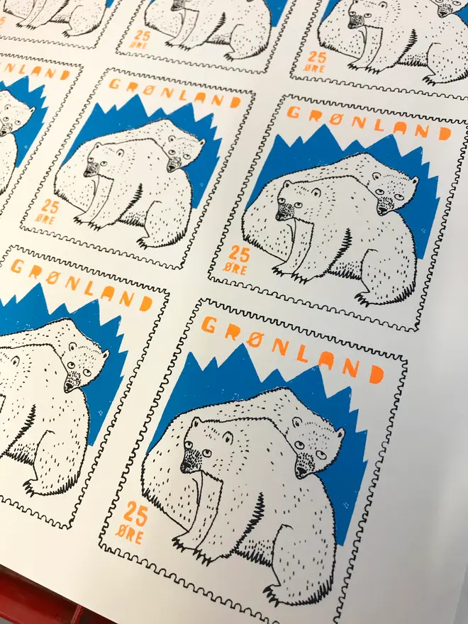 Polar Bear Have A Grrreat Christmas Card, a white card with a colourful polar bear design in the centre on a plain white surface. 