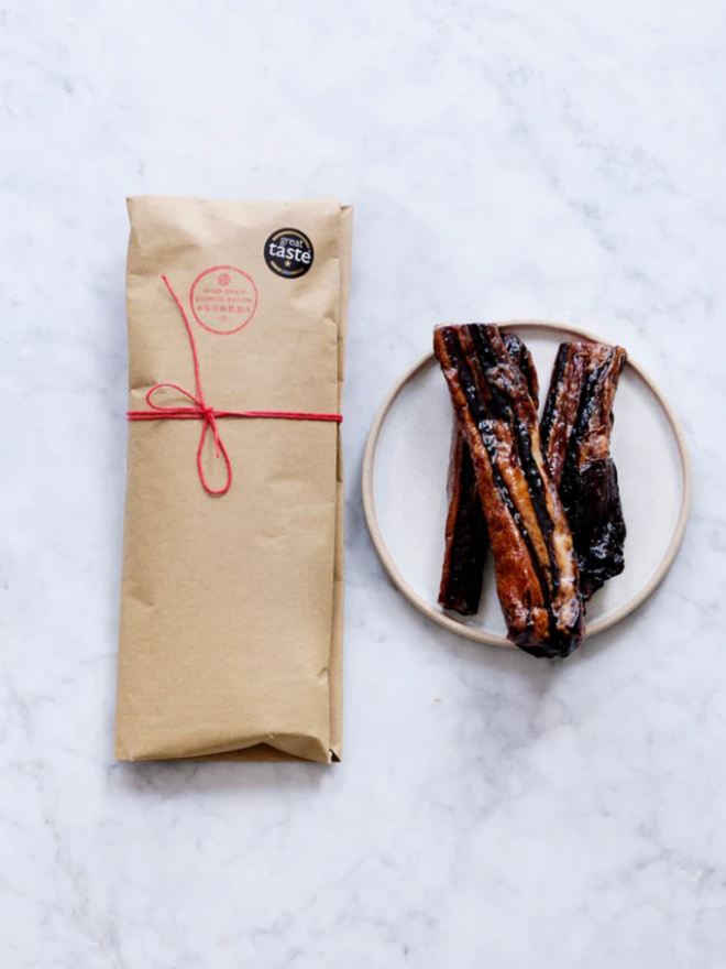 Wind Dried Chicken Bacon. A package of chicken bacon.