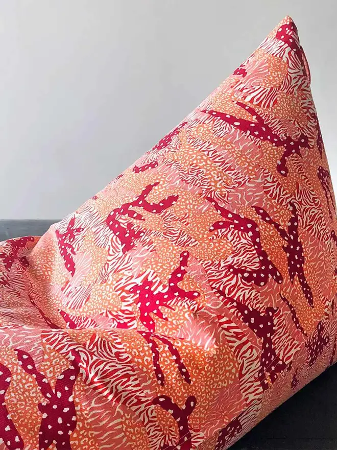 orange Big Cat Camo Bean Bag Cover, an orange bean bag cover sitting against a white backdrop.