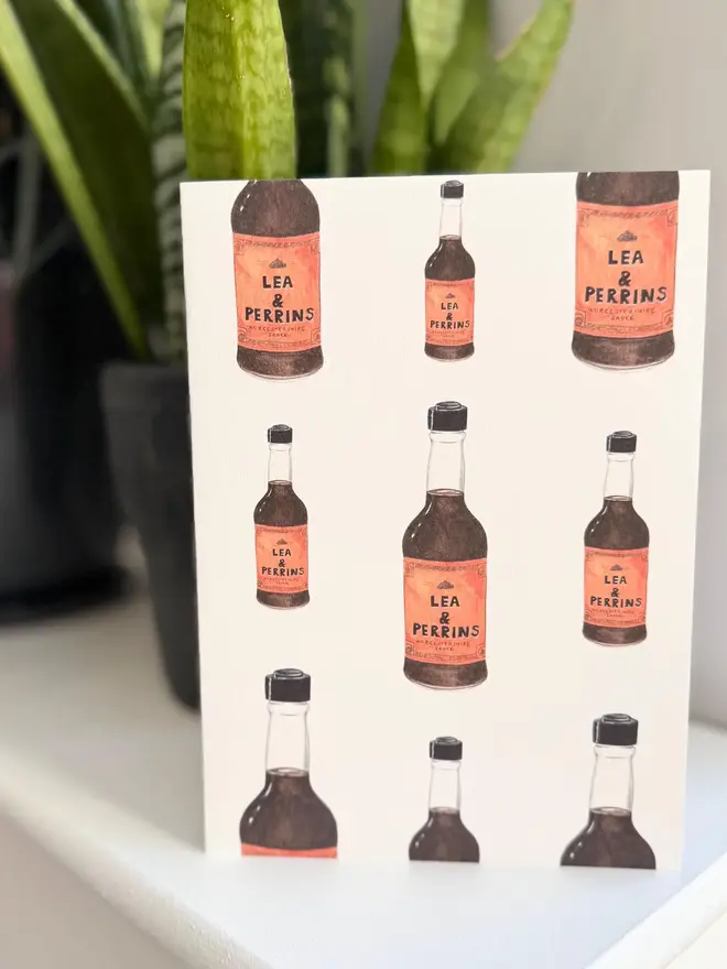worcestershire sauce bottles illustrated card. card placed on mantelpiece.