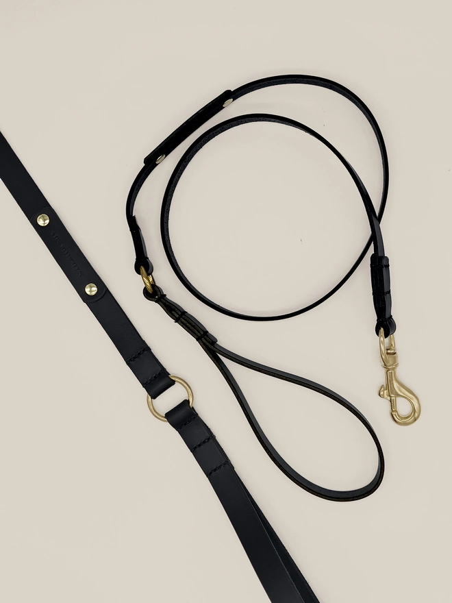 2 black leather dog leads birds eye. view