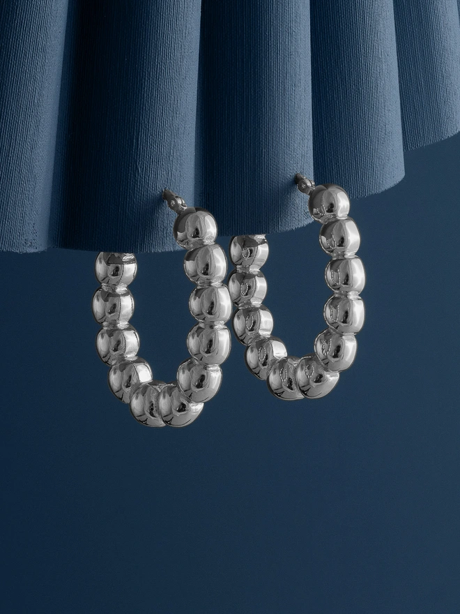 Loel Silver Beaded Oval Hoop Earrings