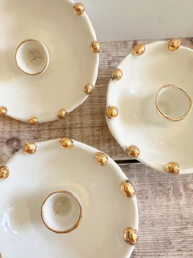 Handmade Gold Star Porcelain Candle Holder Gift (Set Of 3), set of three candle holders on a table. 