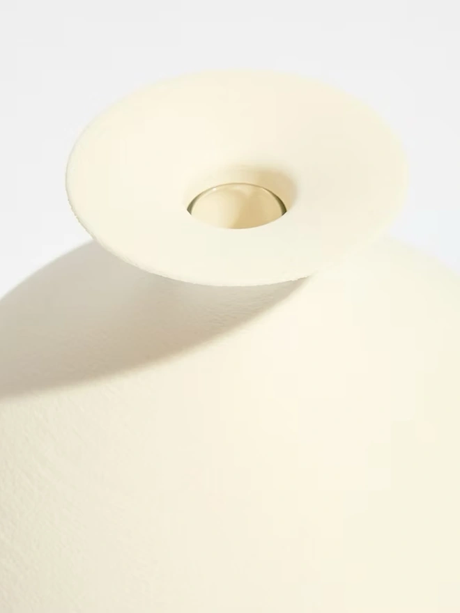 top of white 3d printed vase with glass beaker inside