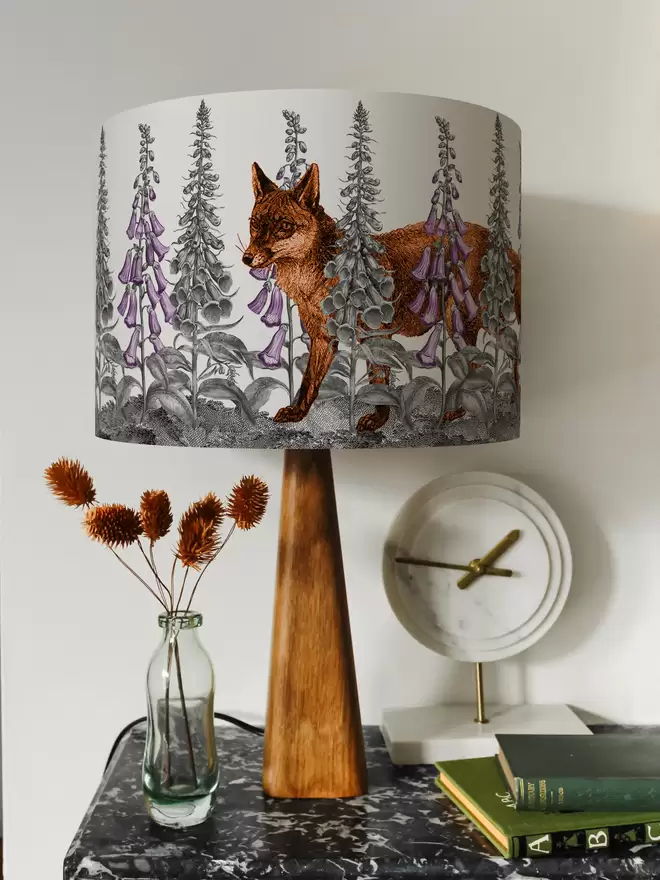Mountain and Molehill – Fox in Foxgloves lampshade on a shelf with ornaments 